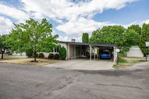 View of front facade featuring a carport