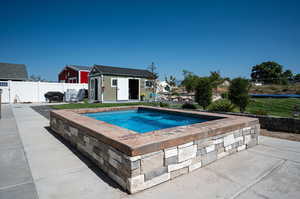 View of 9'X13" in ground hot tub.