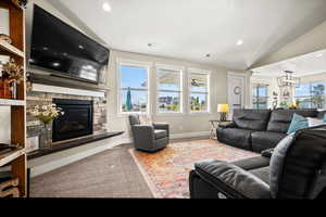 LVP flooring on main floor great room with stone fireplace.