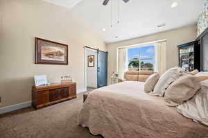 Owner's suite with lofted ceiling and custom barn door.