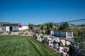 View of terraced yard with garden boxes.