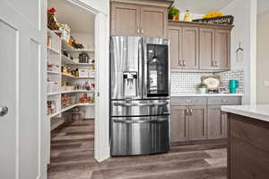 Spacious L shaped pantry with built-in shelving,