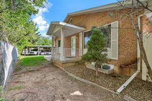 View of home's exterior with a porch