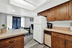 Kitchen featuring white refrigerator and light wood-type flooring