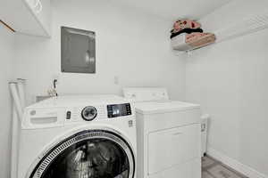 Clothes washing area with electric panel and washing machine and dryer