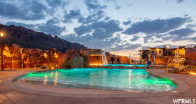 View of pool with a mountain view