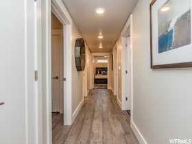 Hall with light hardwood / wood-style flooring