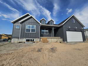 View of front of home featuring a garage