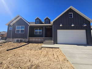 View of front facade featuring a garage