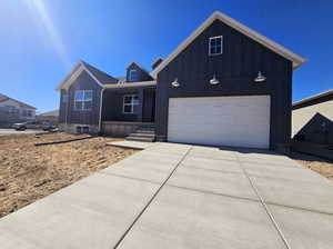 View of front of home featuring a garage