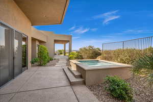 View of patio / terrace featuring an in ground hot tub