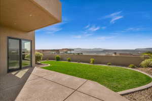 View of yard with a mountain view and a patio