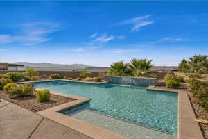 View of pool featuring pool water feature and a mountain view