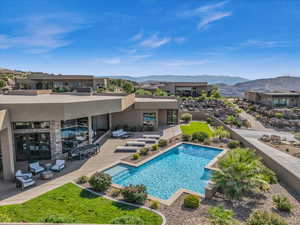 View of pool featuring outdoor lounge area, a patio area, and a mountain view