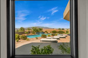 Exterior space featuring a patio area and a mountain view