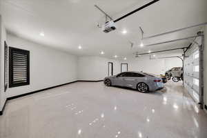 Garage featuring a garage door opener