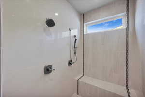 Bathroom featuring tiled shower