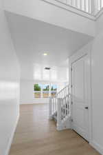 Corridor featuring light hardwood / wood-style floors