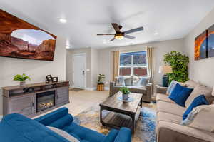 Tiled living room featuring ceiling fan