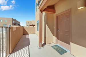 Property entrance with a balcony