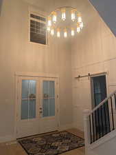 Entryway featuring french doors and hardwood / wood-style floors