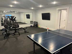 Game room with a textured ceiling