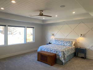 Carpeted bedroom with ceiling fan