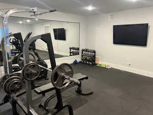 Workout room featuring a textured ceiling