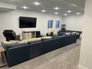 Living room featuring billiards and light colored carpet