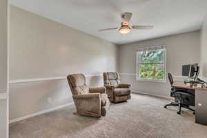 Office space featuring ceiling fan and carpet flooring