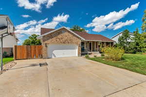 View of front facade with a garage and a front yard