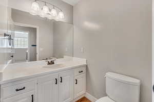 Bathroom featuring vanity and toilet