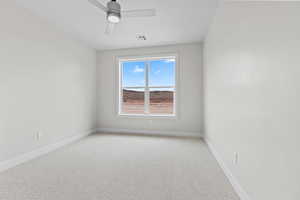 Spare room with light carpet, ceiling fan, visible vents, and baseboards