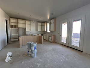 Kitchen with a kitchen island and light brown cabinets