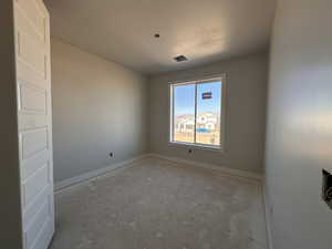 Empty room with a textured ceiling