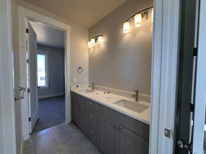 Bathroom with vanity and a textured ceiling