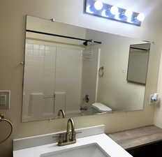 Full bath with vanity and shower / tub combination