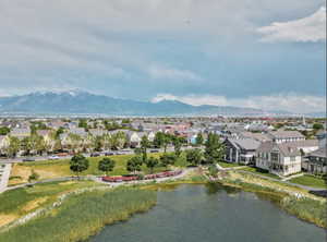 Unrivaled location with picturesque views of  a serene stream and Oquirrh lake from the kitchen and dining area