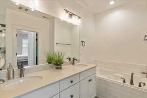 Master Bathroom features a soaker tub and shower and dual sinks