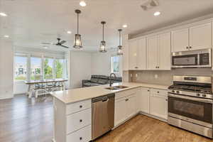 Dining area features large windows with gorgeous views of a stream and Oquirrh Lake