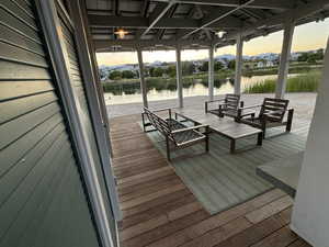 Exclusive Waterside Club entertaining area with fireplace and paddleboards