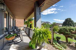 Balcony featuring covered porch