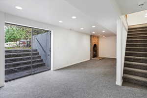 Interior space with carpet and a fireplace