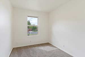 View of carpeted spare room