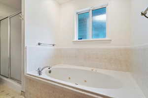 Bathroom with plus walk in shower