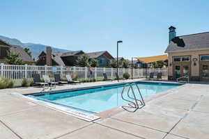 View of swimming pool featuring a mountain view and a patio area