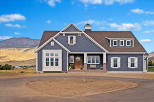 View of front of home featuring a mountain view