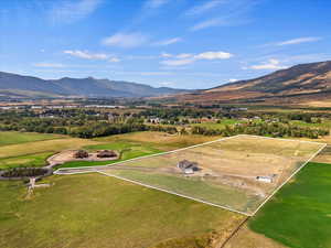 Drone / aerial view with a mountain view and a rural view