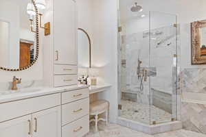 Bathroom with separate shower and tub and vanity