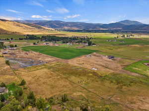 Drone / aerial view with a mountain view and a rural view